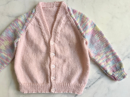 Handknitted Cardigan - 2 years Pastel Pink with Multi Rainbow arms